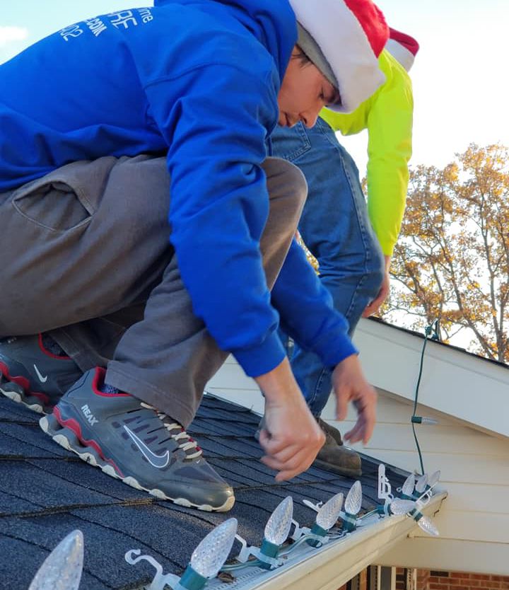 installing professional lights on roofline